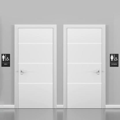 Black restroom signs for men, women, and handicap, installed on doors for public or commercial bathrooms