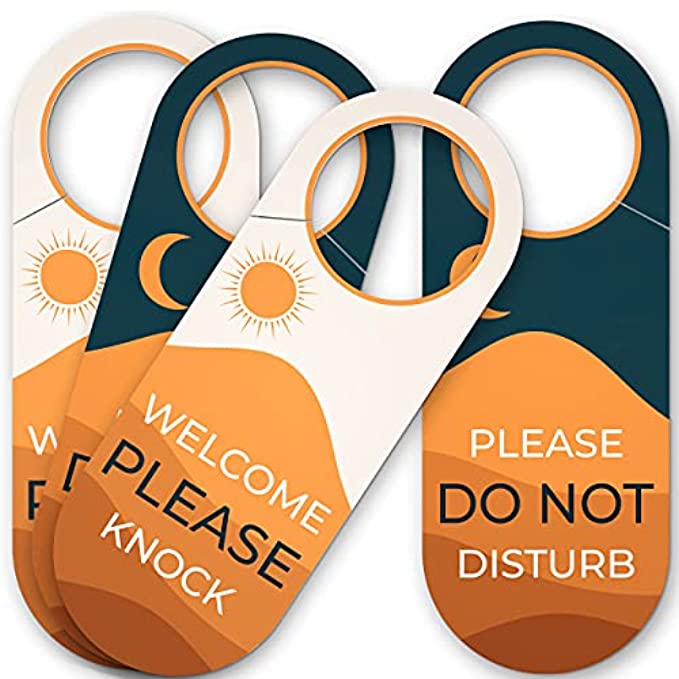 Pack of four double-sided ‘Please Knock’ and ‘Do Not Disturb’ door hanger signs, designed for long-lasting use in professional and personal spaces