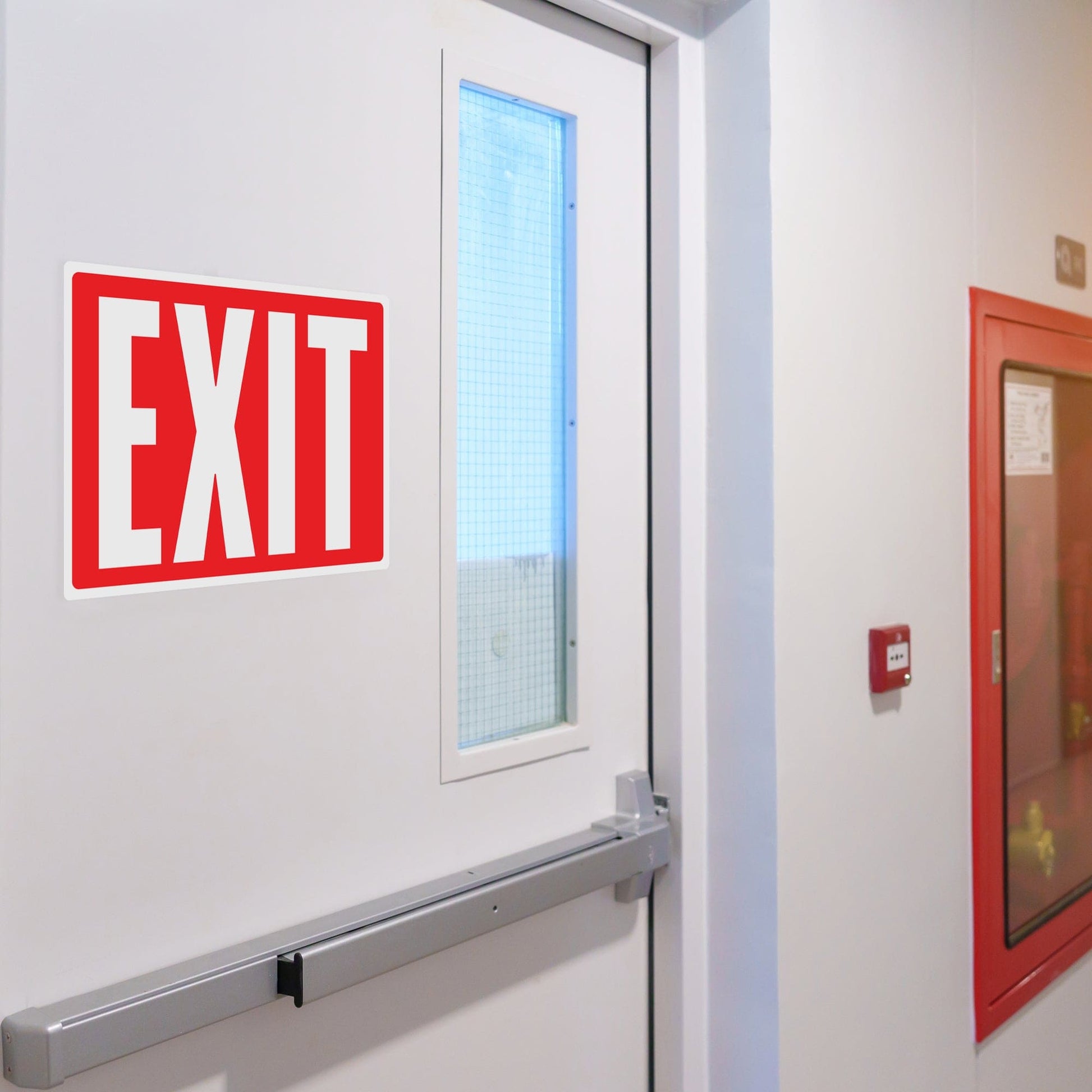 Glow-in-the-dark emergency exit sign installed on an office door. Designed for quick and easy installation on doors and walls, these durable vinyl stickers ensure visibility during low-light emergencies.