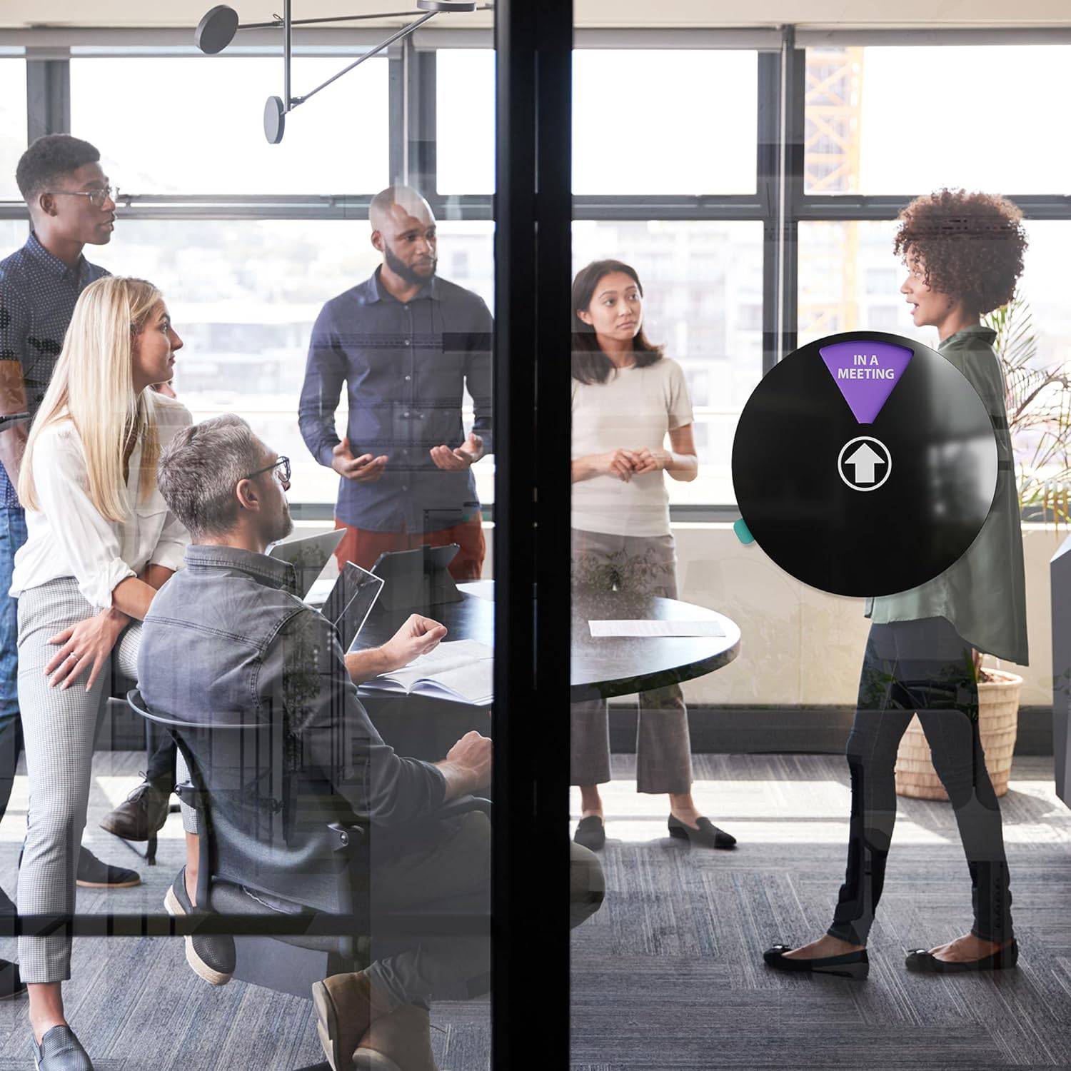 Meeting in progress door sign in use, displaying 'In a Meeting', ensuring clear communication in office conference rooms or shared workspaces.