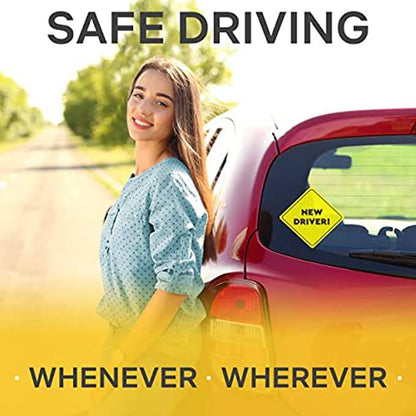 A young woman smiling next to a red car with the Assured Signs "New Driver" sticker applied to the rear window, emphasizing safe driving