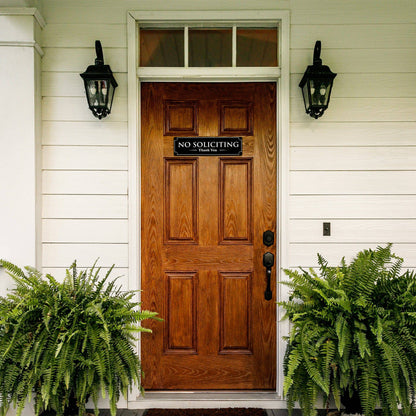 no soliciting sign displayed on a front door to prevent unwanted visitors and salespeople