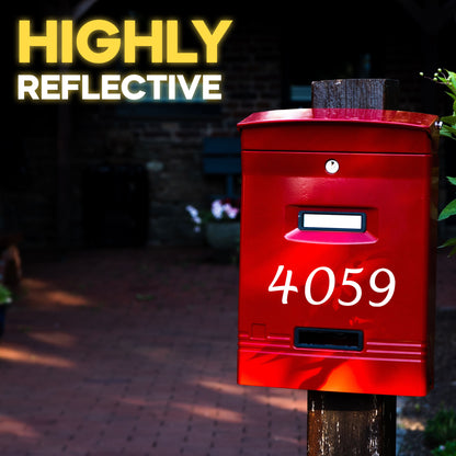 Red mailbox with reflective mailbox number stickers, showcasing the high-visibility and weatherproof quality of the reflective decals in a nighttime setting