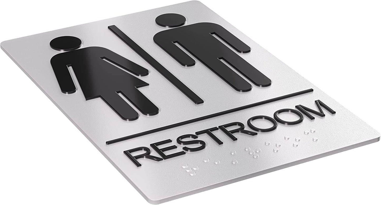 Restroom signage with male and female symbols, black and silver design, and braille. Includes adhesive stickers for quick mounting, perfect for public restroom use in commercial buildings