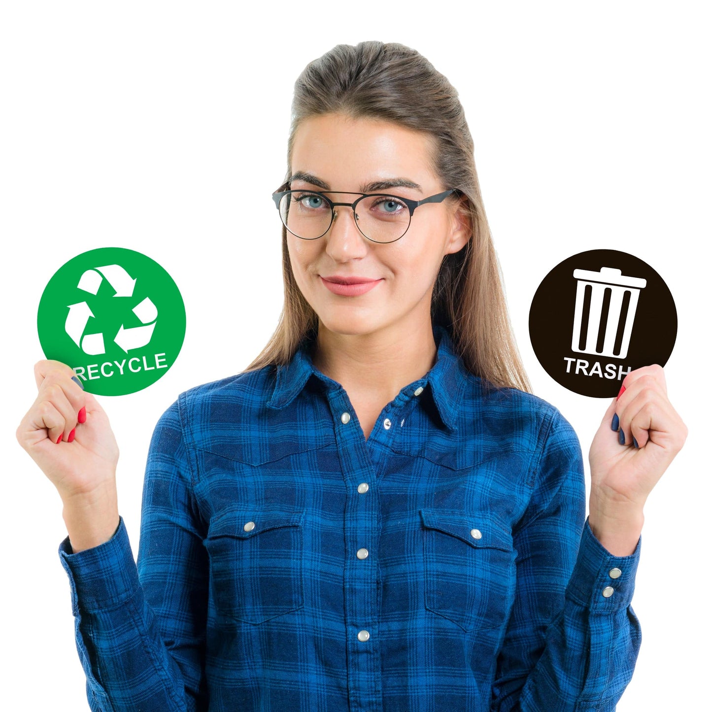 A woman holding a green recycle sticker in one hand and a black trash sticker in the other, demonstrating the size and design of the stickers